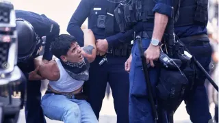 The Latest: Ice, Now Freed of Restraints, Launches 'Operation Midway Blitz' in Chicago